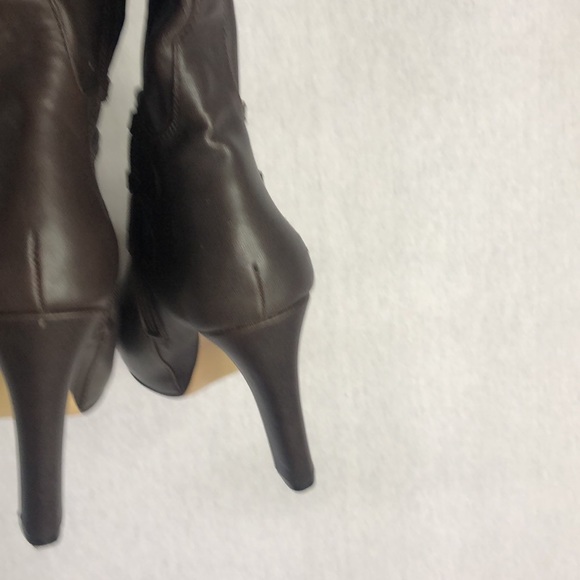 Women’s brown faux leather boots in a size 8 1/2 with a 4 inch heel. - Picture 5 of 7